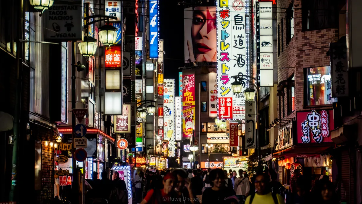 Crowds beneath the neon signs of Dotonbori, Osaka